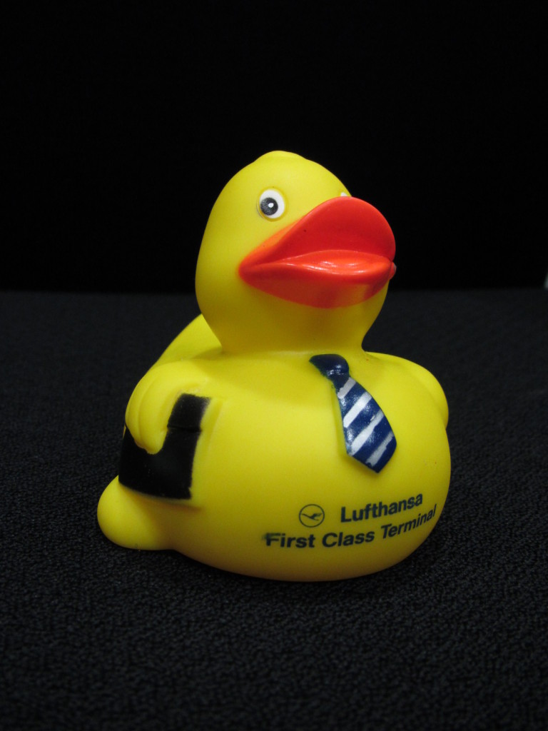 a yellow rubber duck with a tie