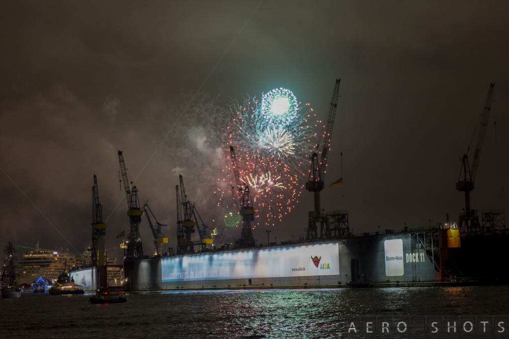 fireworks over a large ship
