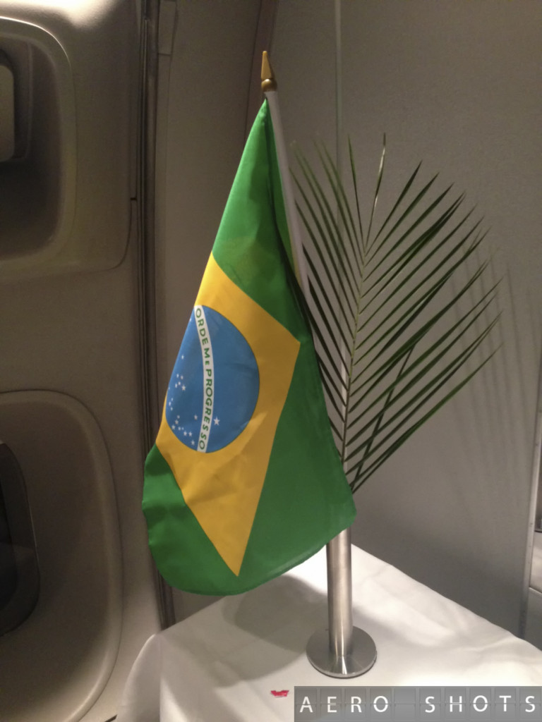 a green and yellow flag on a pole