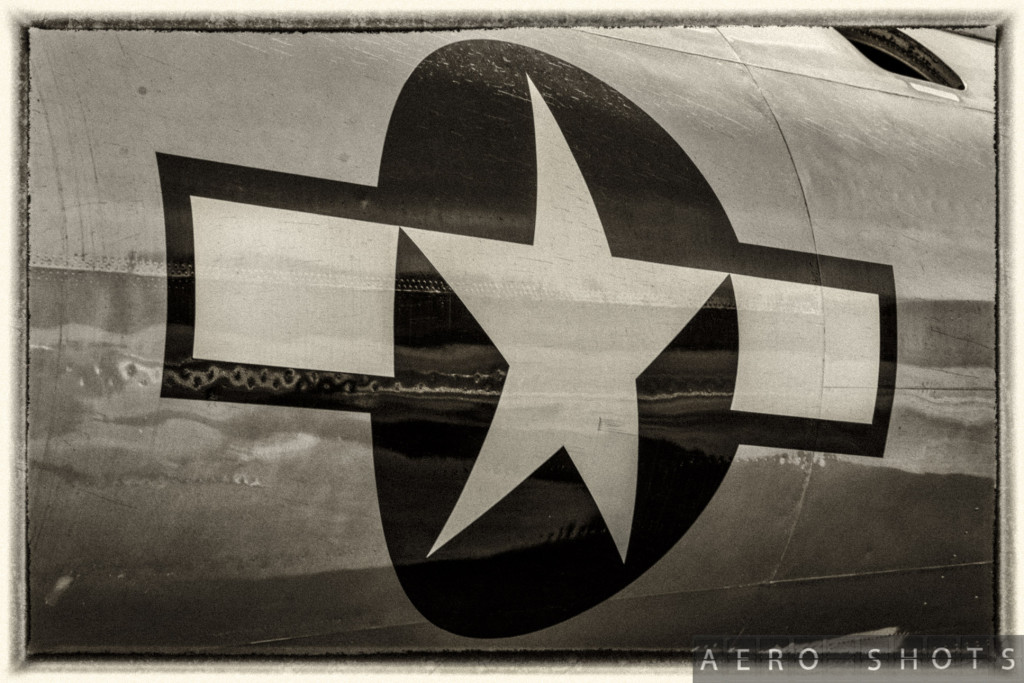 a black and white photo of a star on a plane