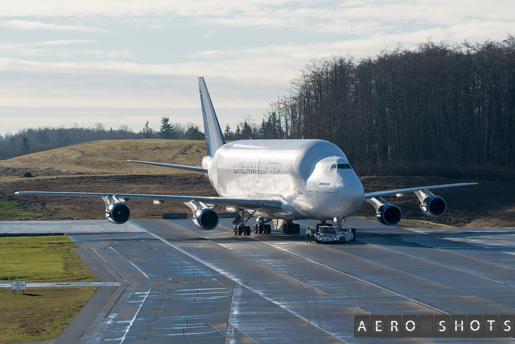 a large white airplane on a runway