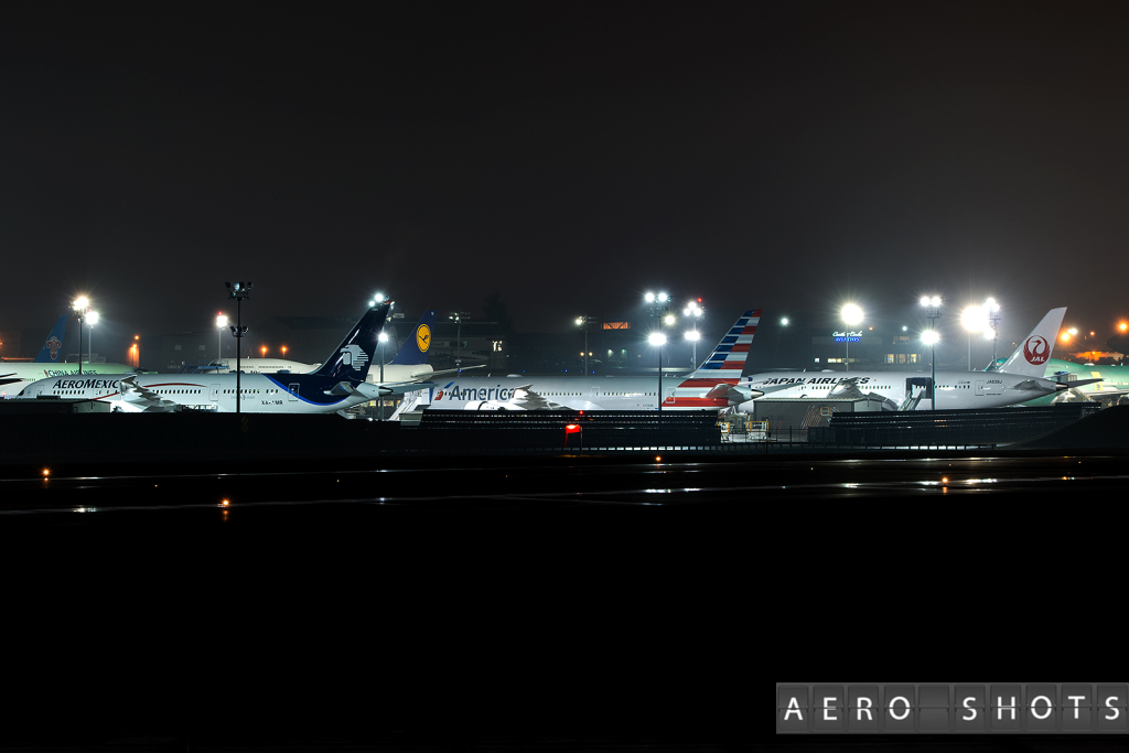 airplanes at an airport at night
