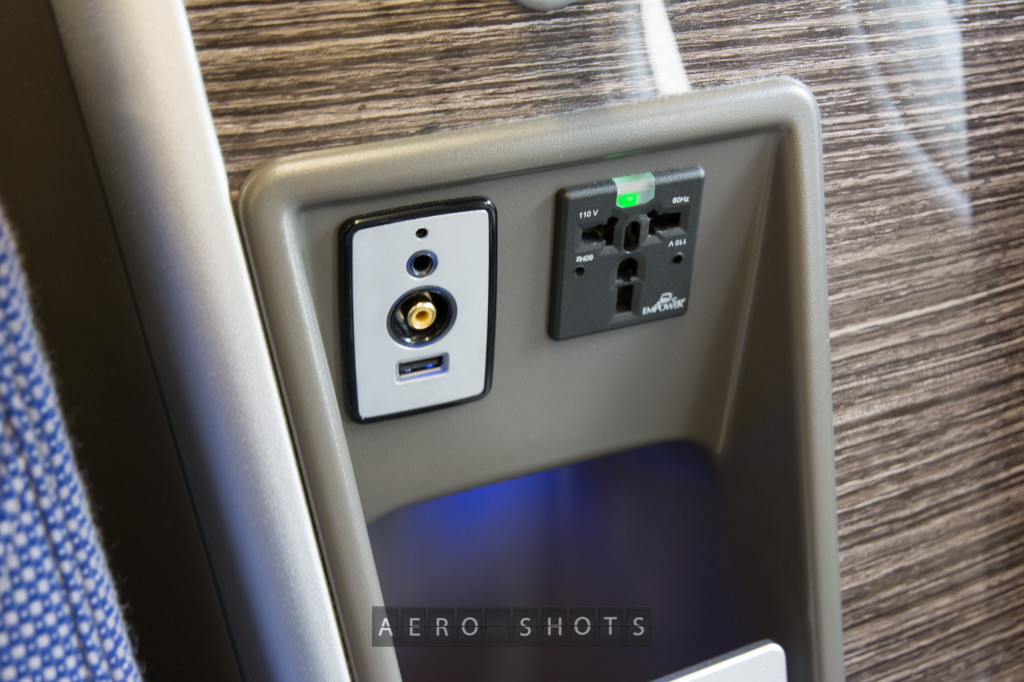 Each seat comes with a USB port, Headphone jack and power outlet.  An additional USB port and headphone jack are located on the IFE screen.