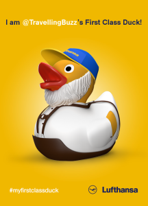 a yellow rubber duck with a hat and suspenders