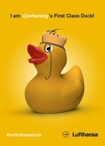 a yellow rubber duck with a crown on its head