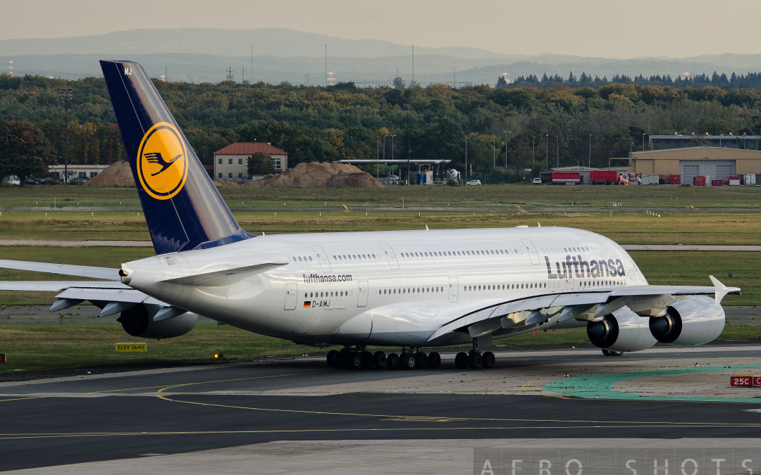 a large white airplane on a runway