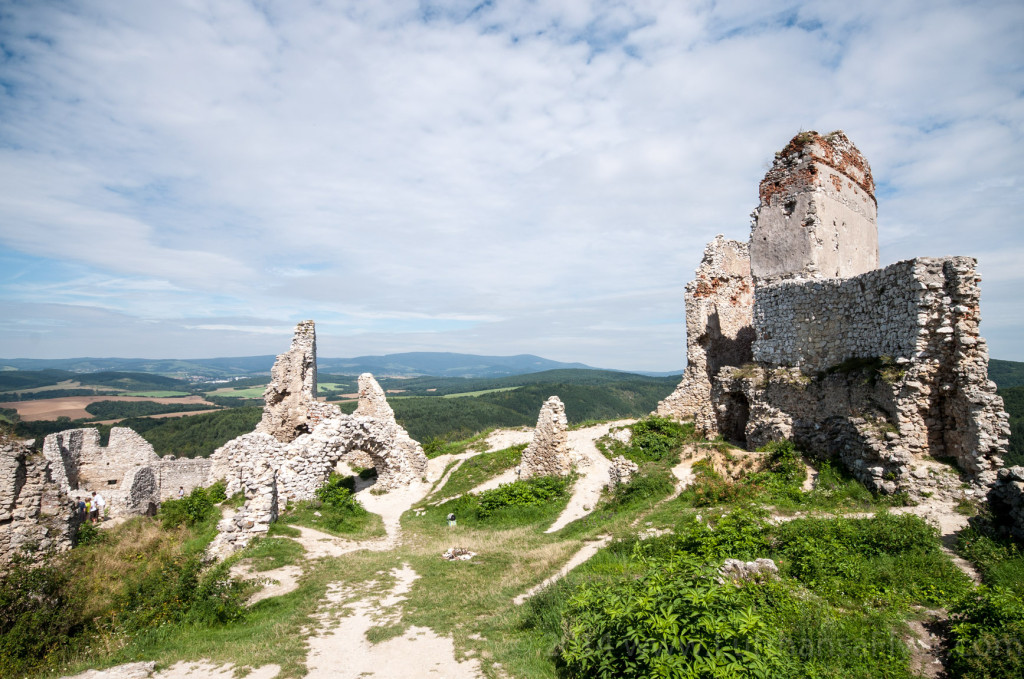 a ruins of a castle on a hill