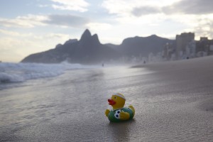 a rubber duck on a beach