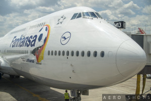 a large white airplane with a logo on it