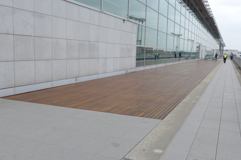 Not sure why you would use Teak in an area that is abused by the elements.   There was nothing wrong with the concrete slabs.