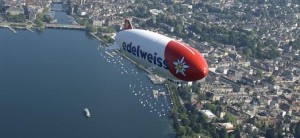 a blimp flying over a city