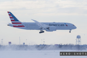 an airplane flying in the snow