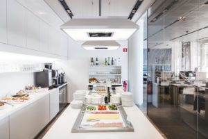a white kitchen with food on the counter