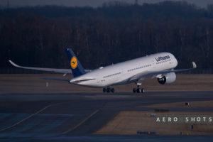 a white airplane taking off