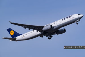 a white airplane with blue and white text