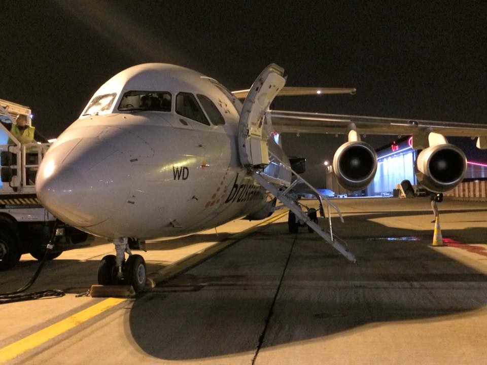 a plane on the runway at night