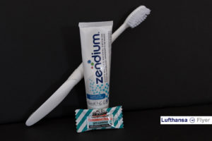 a toothbrush and toothpaste on a black background