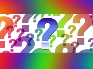 a colorful background with many question marks