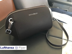 a brown leather bag on a seat